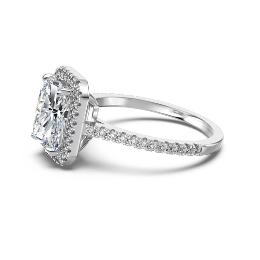 radiant cut moissanite halo ring laid on its side