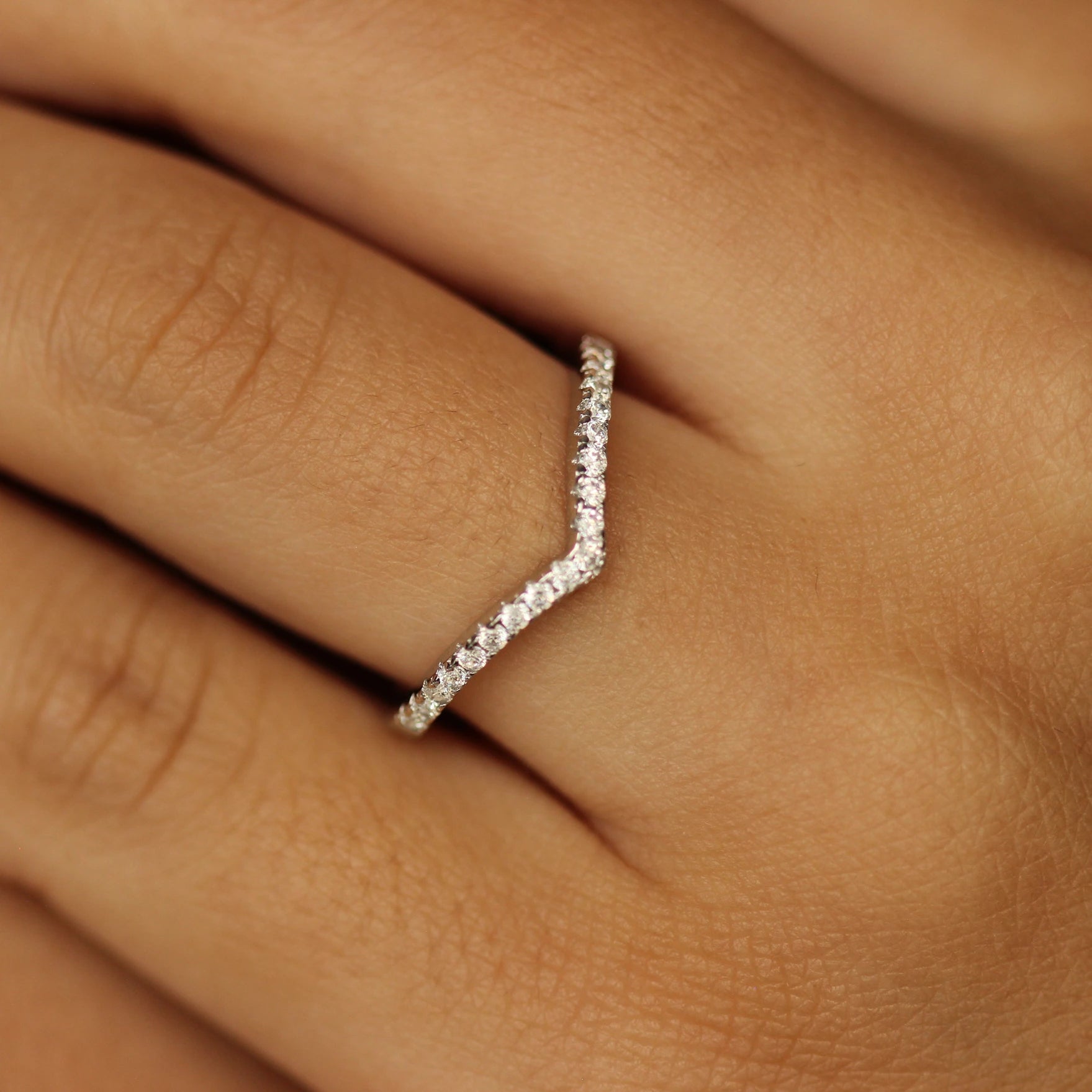 silver wishbone ring on hand