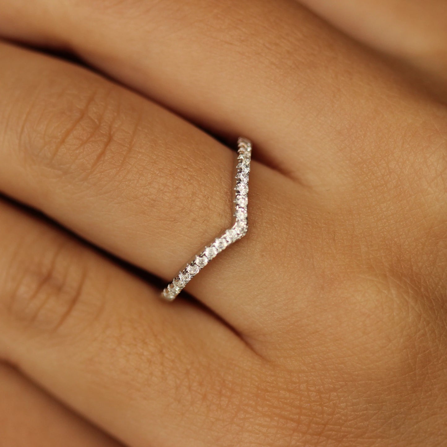 silver wishbone ring on hand